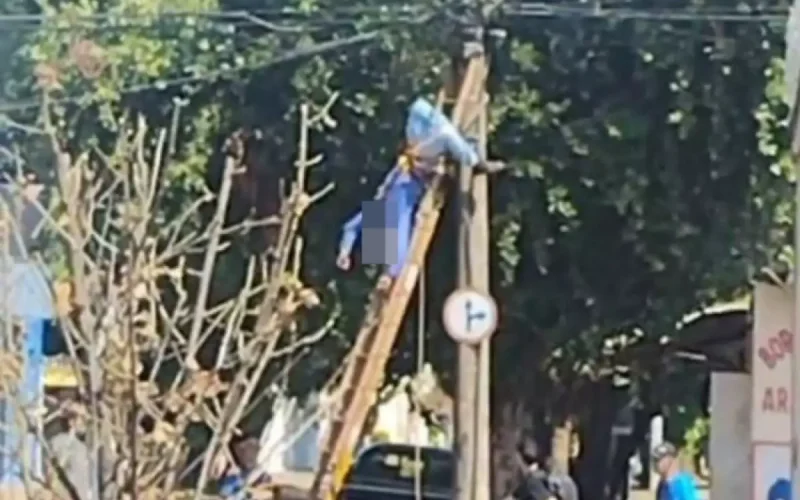Técnico leva choque e fica pendurado em escada